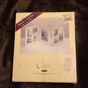 Vintage Robinsons May silver frame holds nine photos